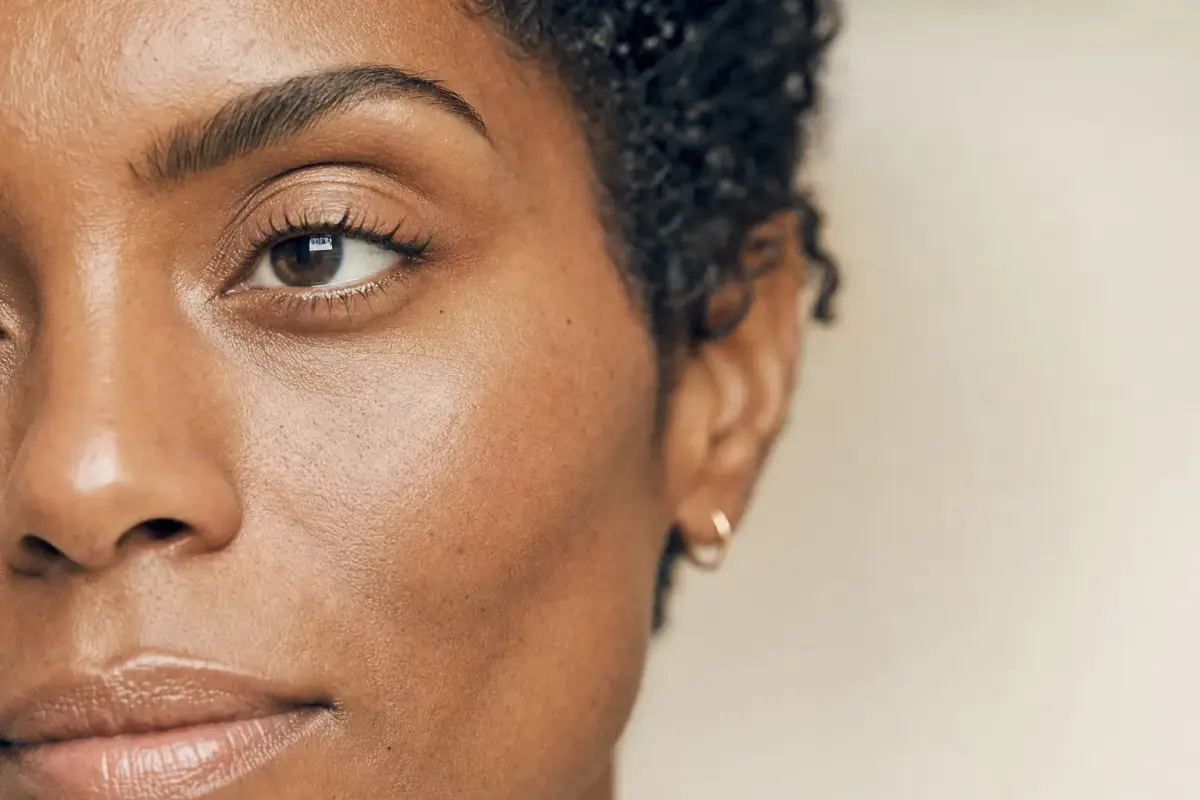 Close-up of a woman in her late thirties with Black skin