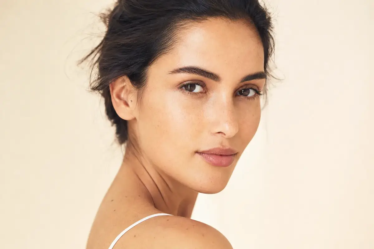 Woman in her late twenties with flawless natural skin