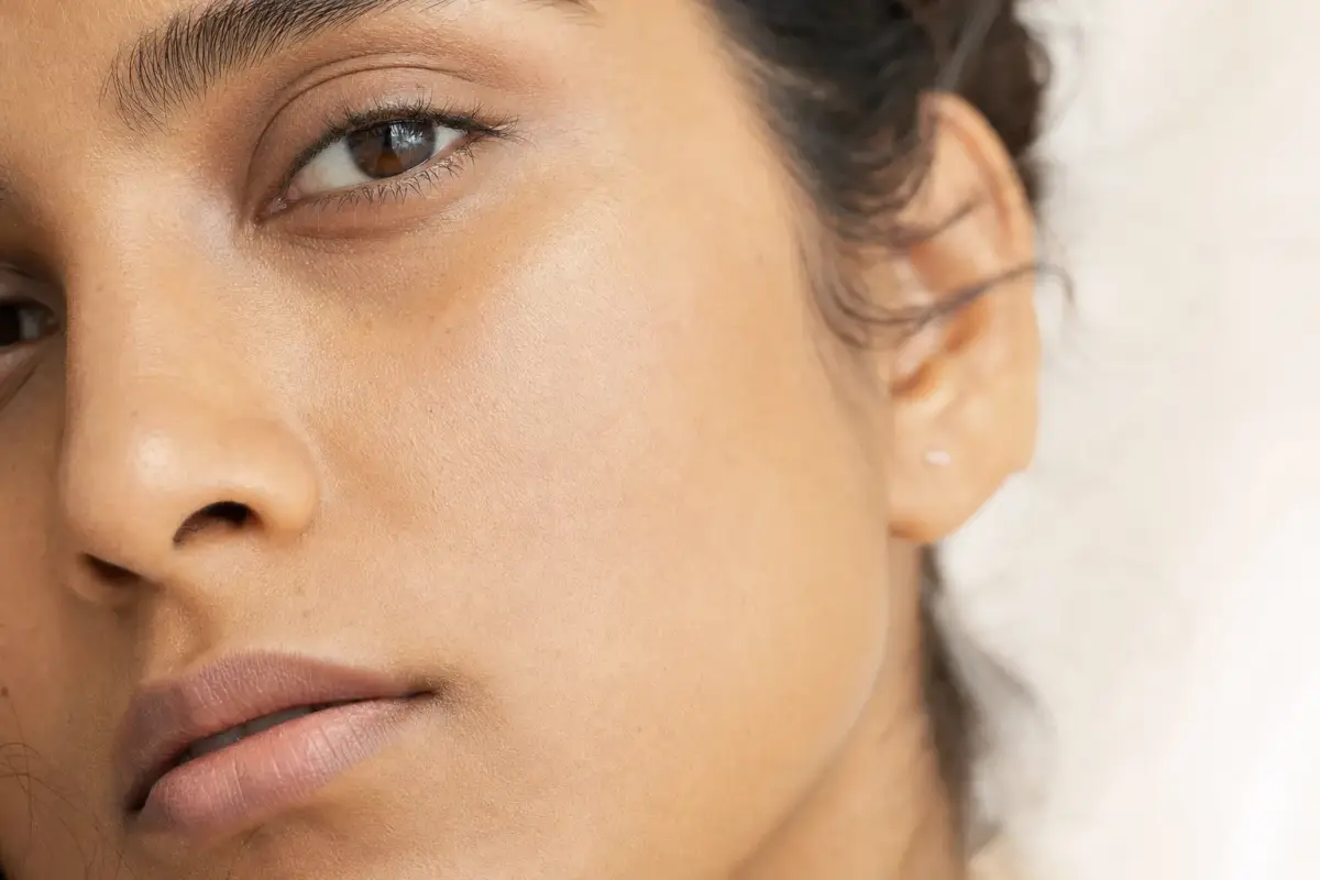 Close-up of a woman in her thirties with South Asian skin