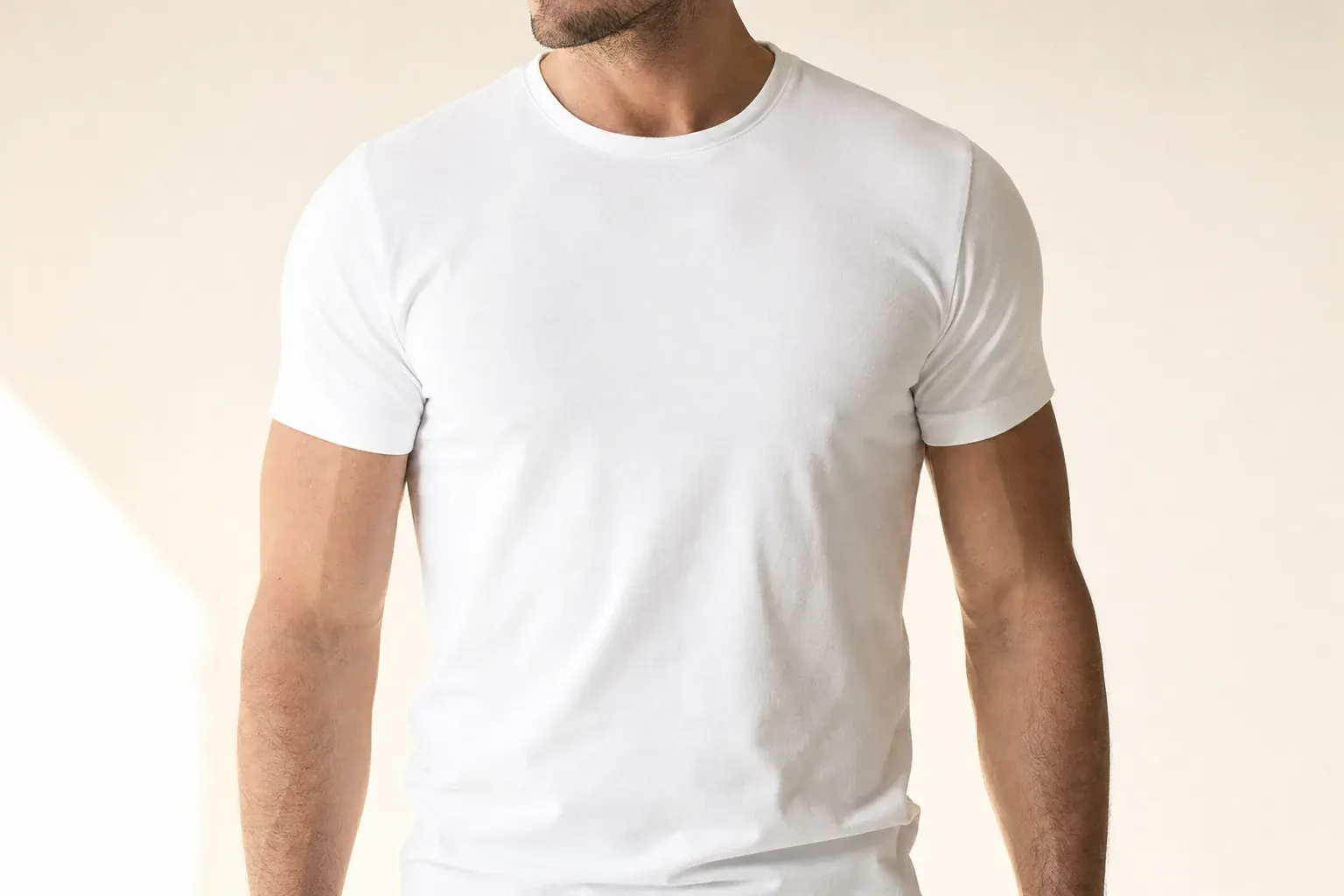 Athletic man in his thirties in a fitted plain white t-shirt