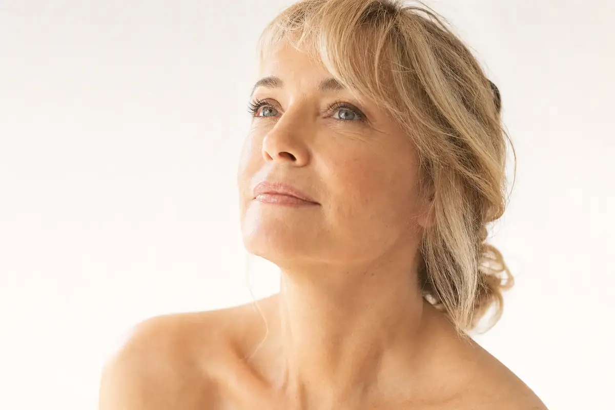 Woman in her fifties with firm smooth neck and jawline
